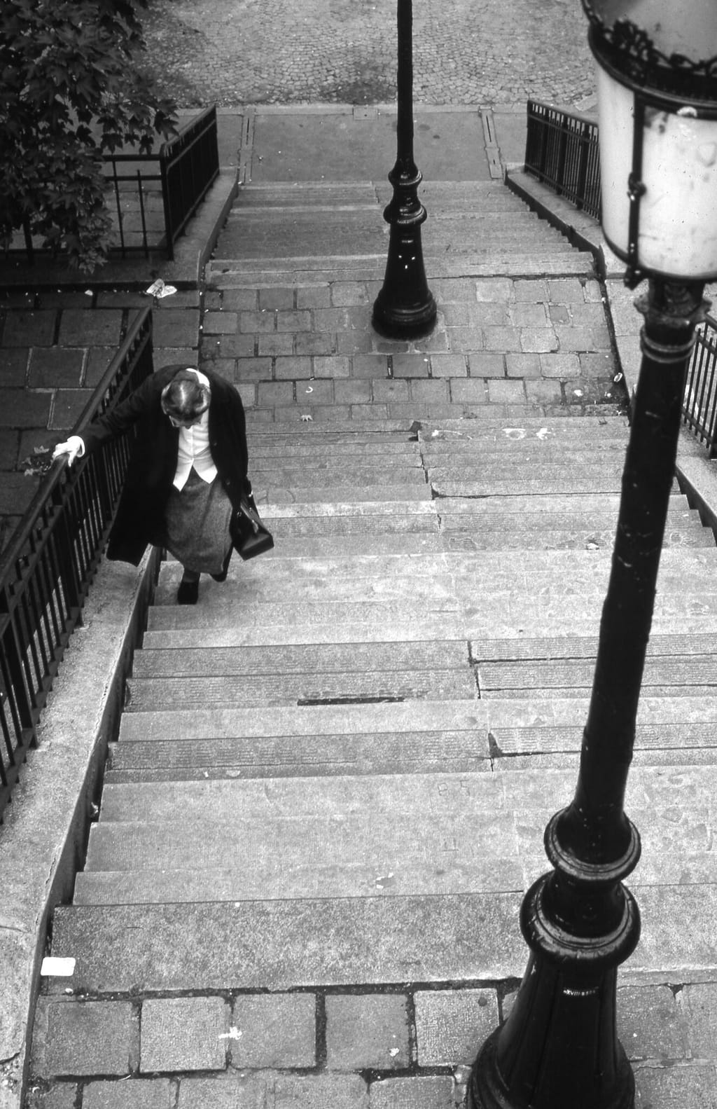 Old woman on steps, Paris