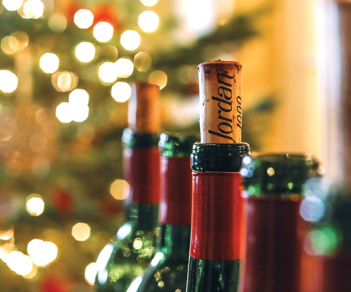 Open bottles of Jordan Cabernet Sauvignon in front of a Christmas tree