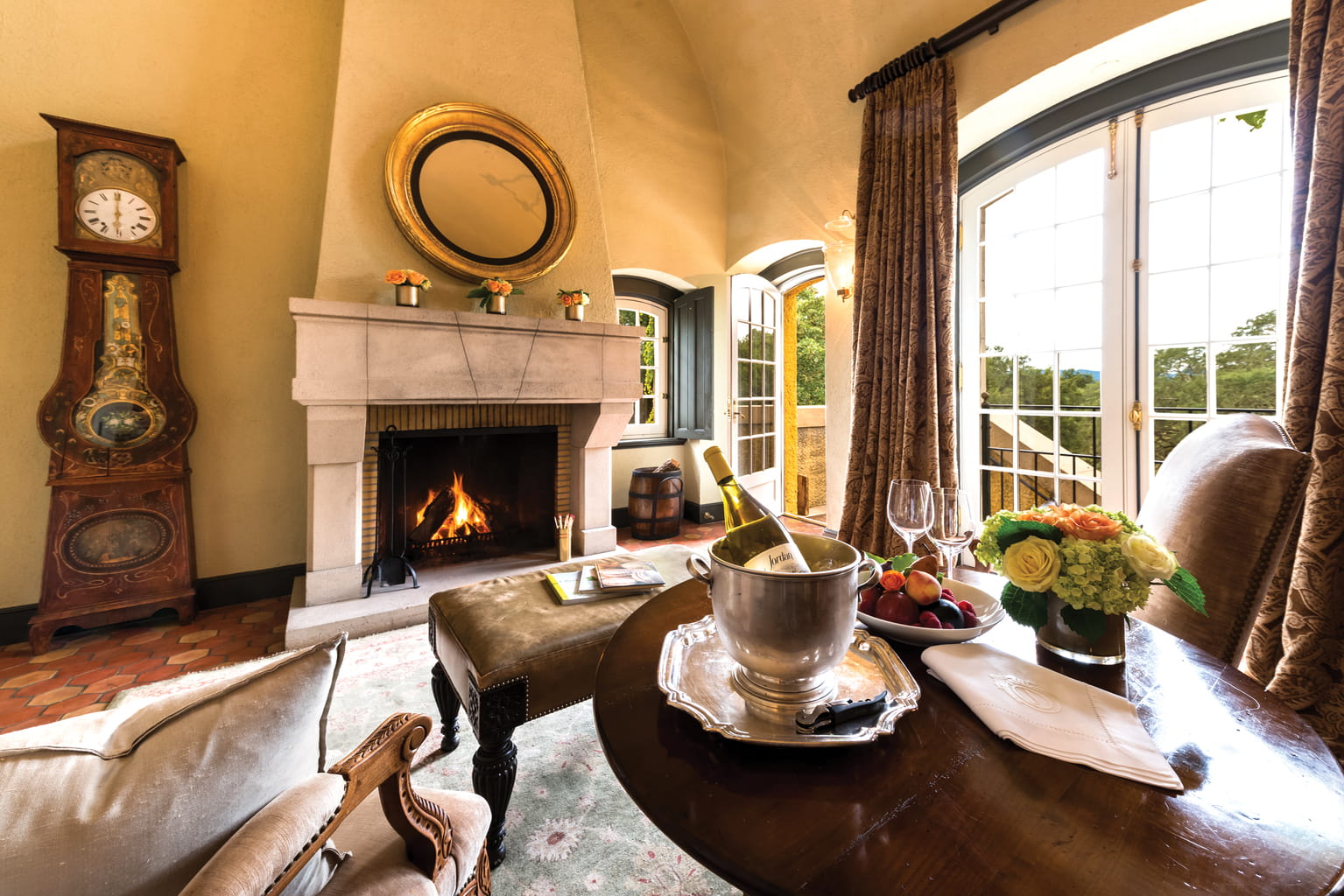 View of the Jordan suite with a fireplace and chilled bottle of Jordan Chardonnay
