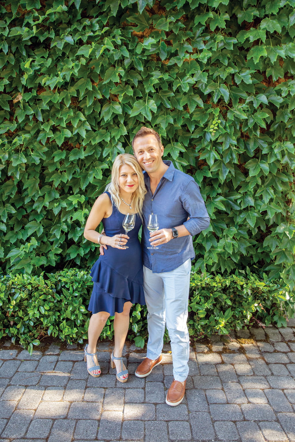 A couple, who are Jordan Estate Rewards members, pose for a photo at a culinary event