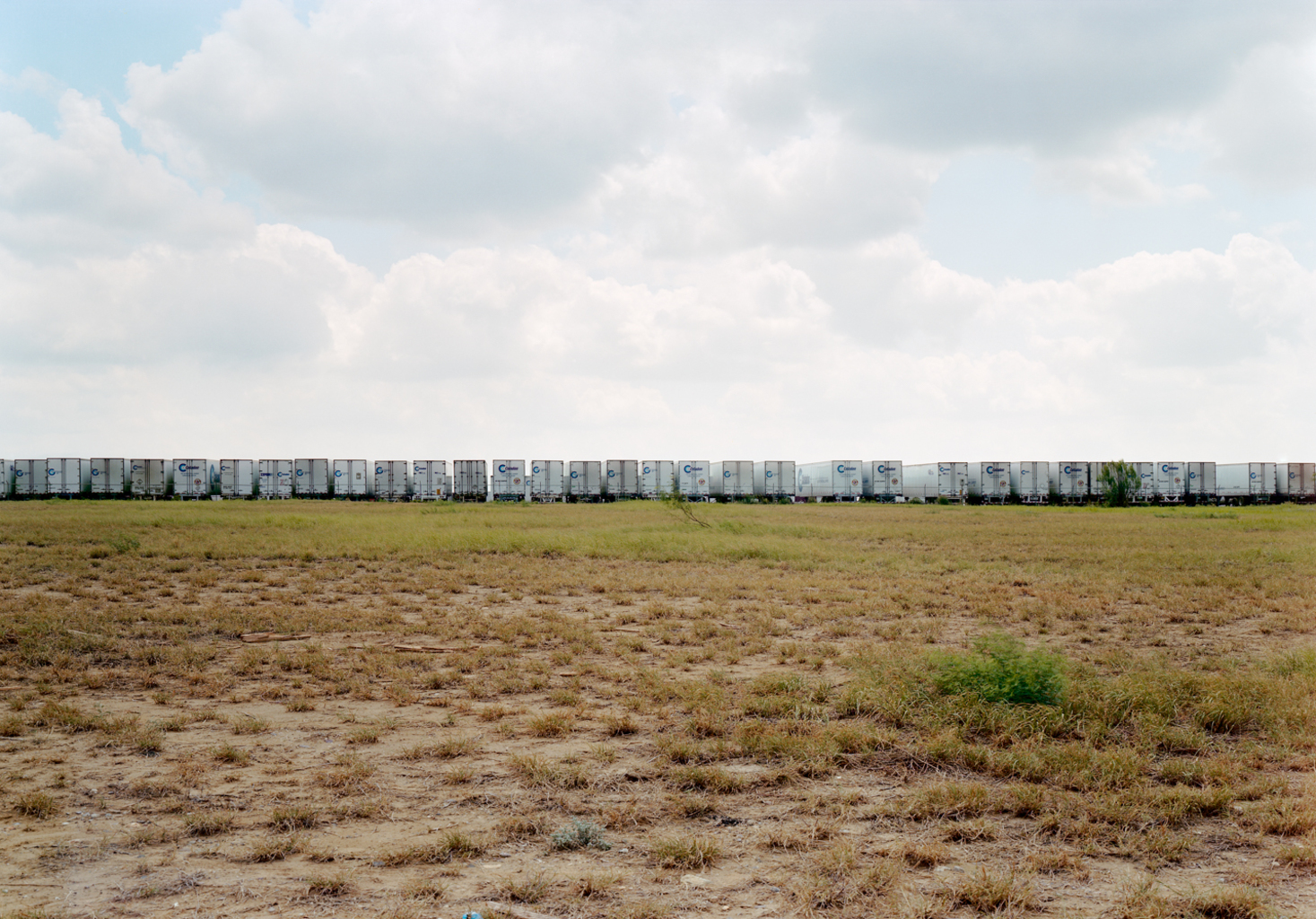 Untitled (Celadon trucks), Laredo, Texas, 2000 © Victoria Sambunaris