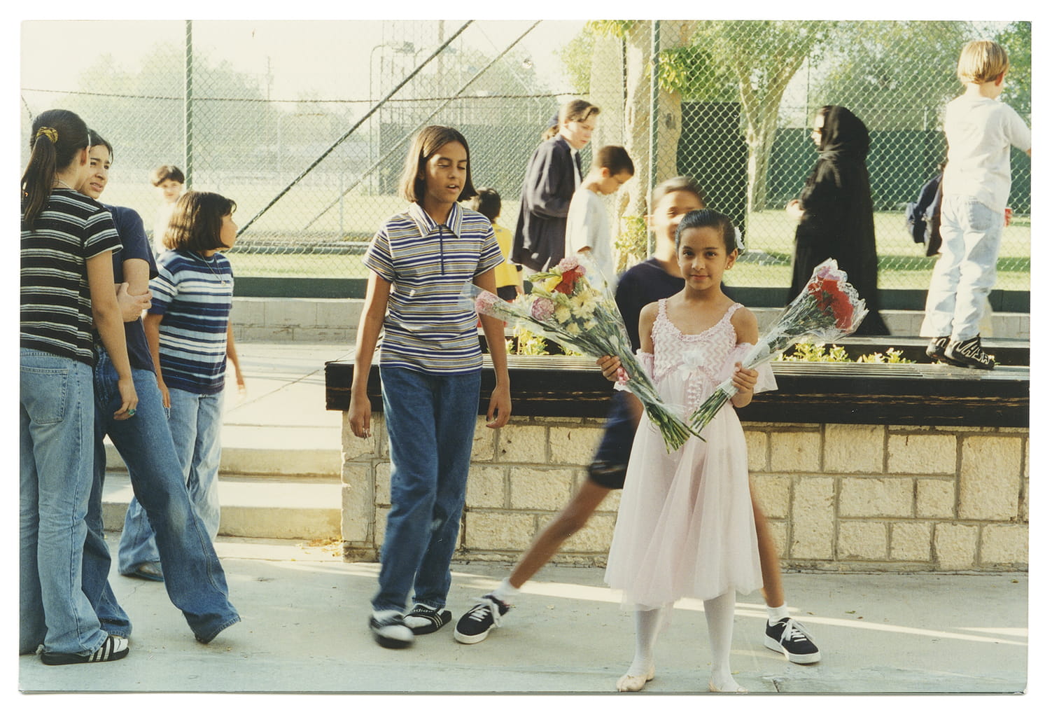 Holding flowers after my ballet recital.