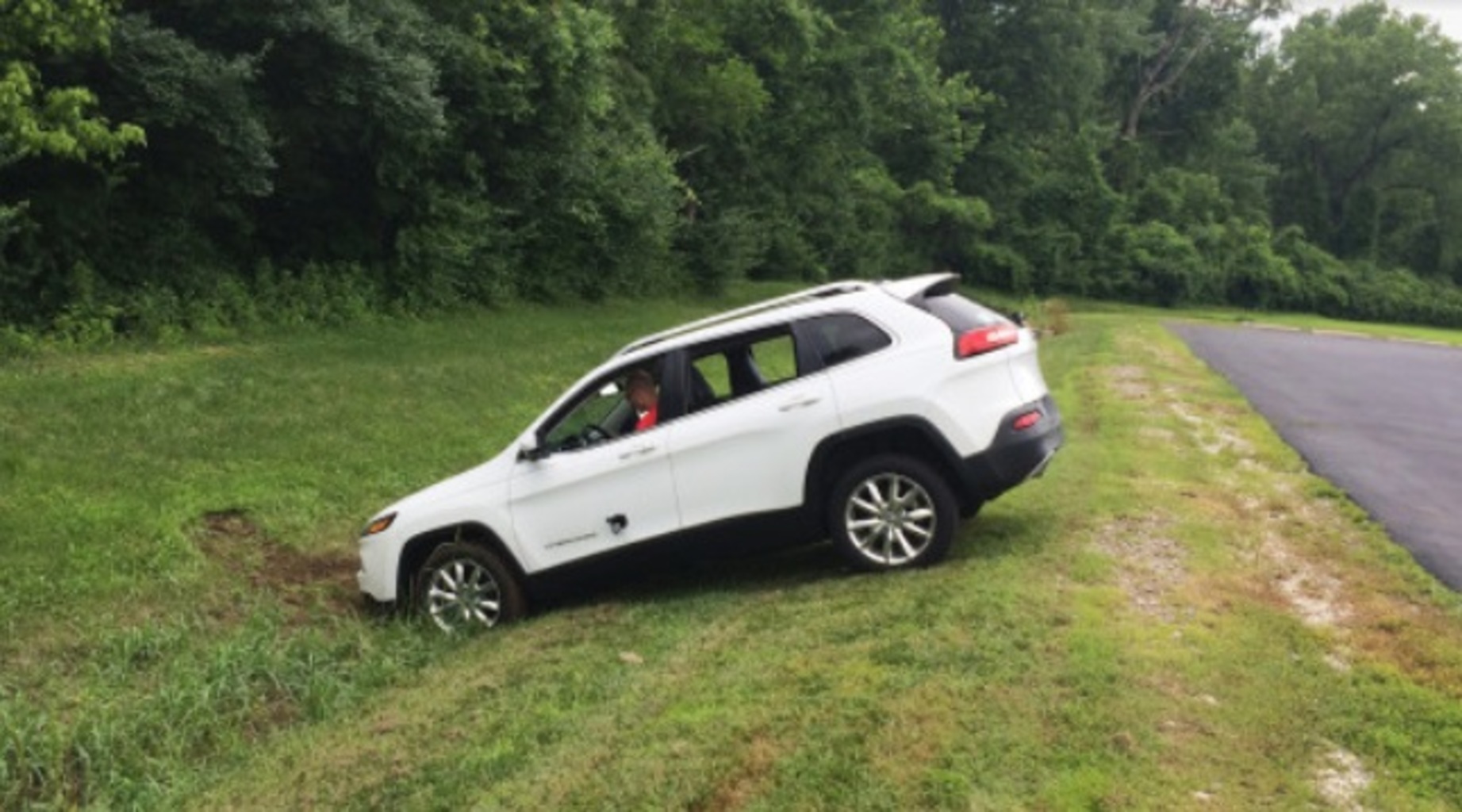 Hacked Jeep Cherokee ends up in a ditch after the brakes were remotely disabled. (Photo by Andy Greenberg of Wired)